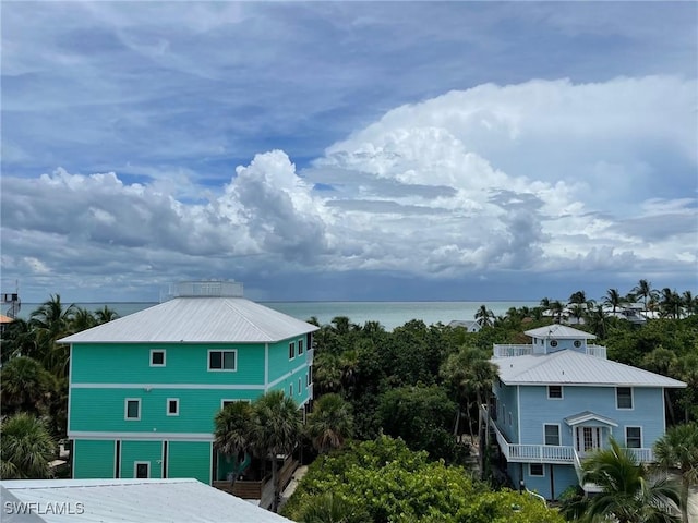 view of property exterior featuring a water view