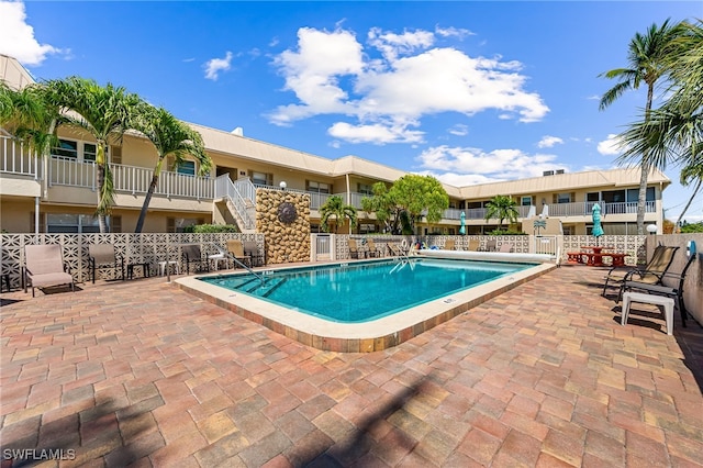 909 SE 46th Ln Unit 207, Cape Coral, FL 33904 - community pool featuring a patio area