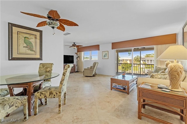 909 SE 46th Ln Unit 207, Cape Coral, FL 33904 - living room with a ceiling fan and light tile patterned flooring