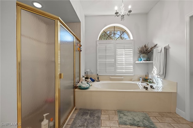 bathroom featuring tile patterned floors, a chandelier, and independent shower and bath