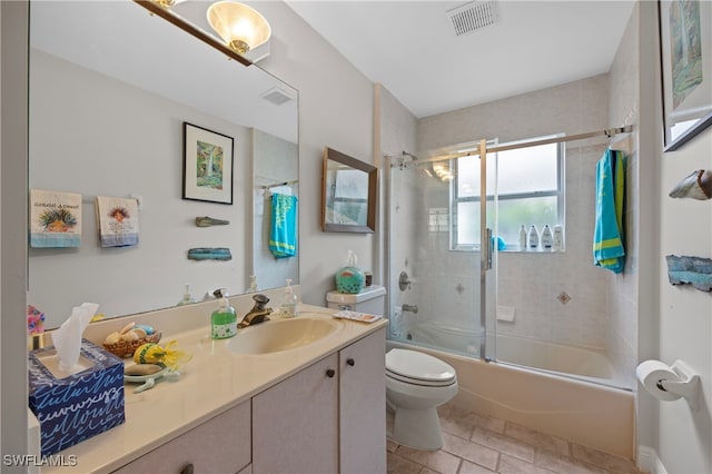 full bathroom featuring vanity, toilet, and enclosed tub / shower combo