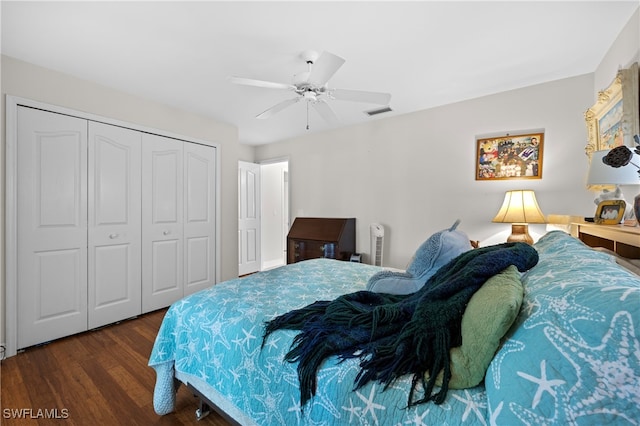 bedroom featuring a closet, ceiling fan, and dark wood-type flooring