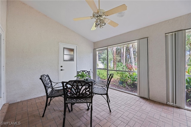 dining area with vaulted ceiling and ceiling fan