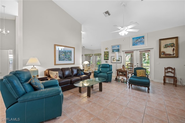 living room featuring ceiling fan with notable chandelier, french doors, high vaulted ceiling, and light tile patterned floors