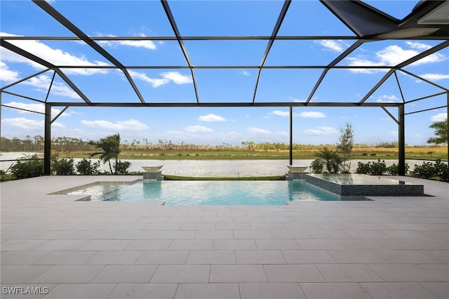 view of swimming pool featuring a water view, a patio, an in ground hot tub, and glass enclosure