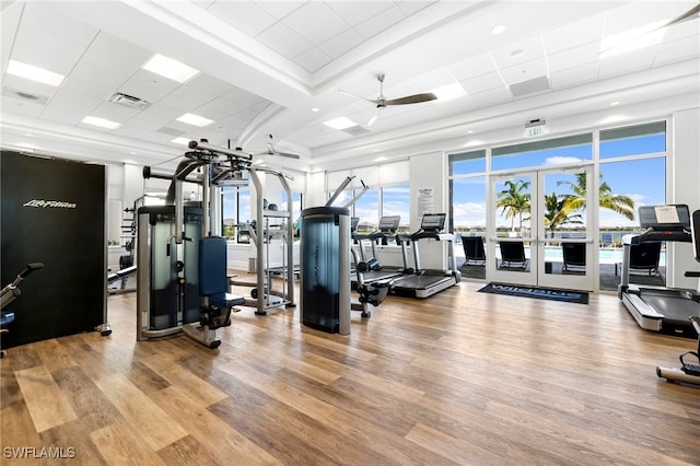 workout area with hardwood / wood-style flooring and french doors