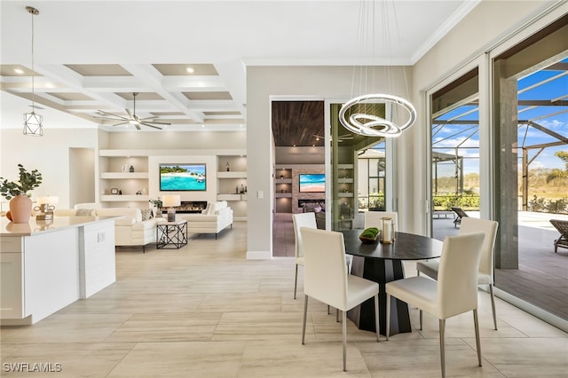 dining room with built in features, ceiling fan, beam ceiling, coffered ceiling, and ornamental molding