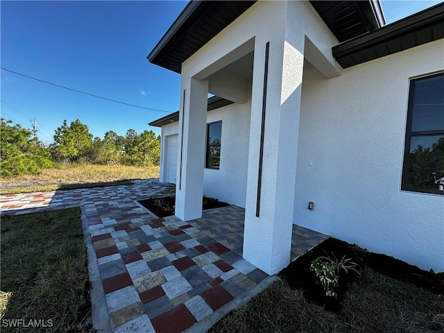 view of patio featuring a garage