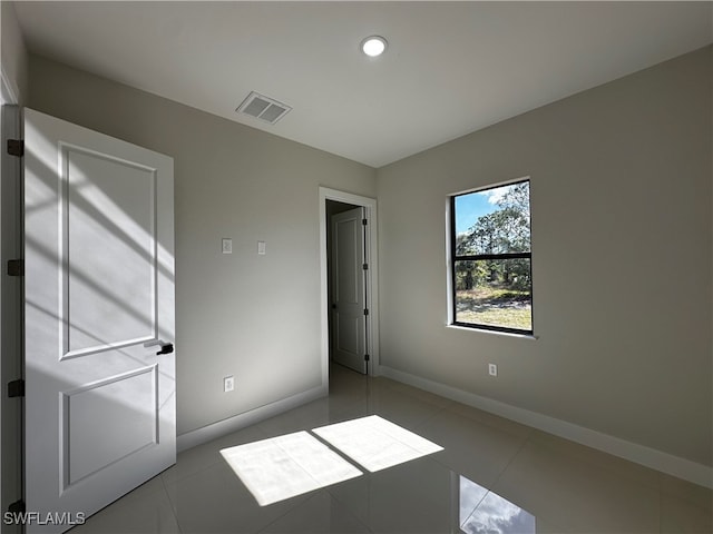 unfurnished bedroom with light tile patterned floors