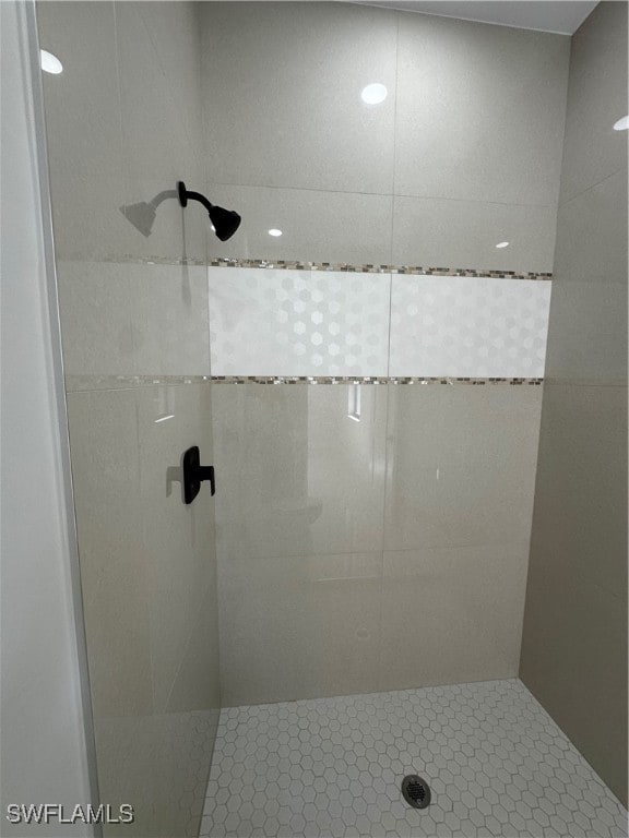 bathroom with tiled shower