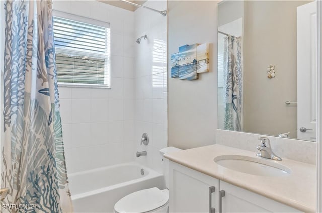 full bathroom with vanity, toilet, and shower / bath combo with shower curtain