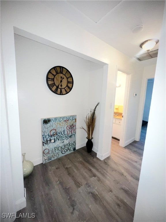 hallway featuring wood-type flooring