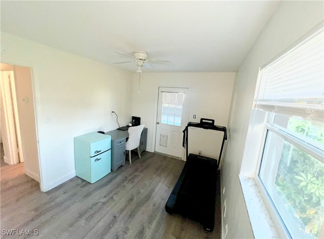 office with ceiling fan, light wood-type flooring, and lofted ceiling