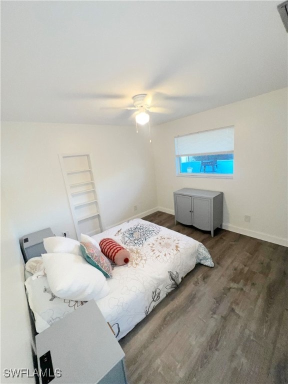 bedroom featuring dark hardwood / wood-style floors and ceiling fan