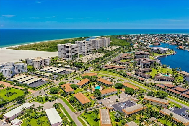 bird's eye view with a water view and a view of the beach