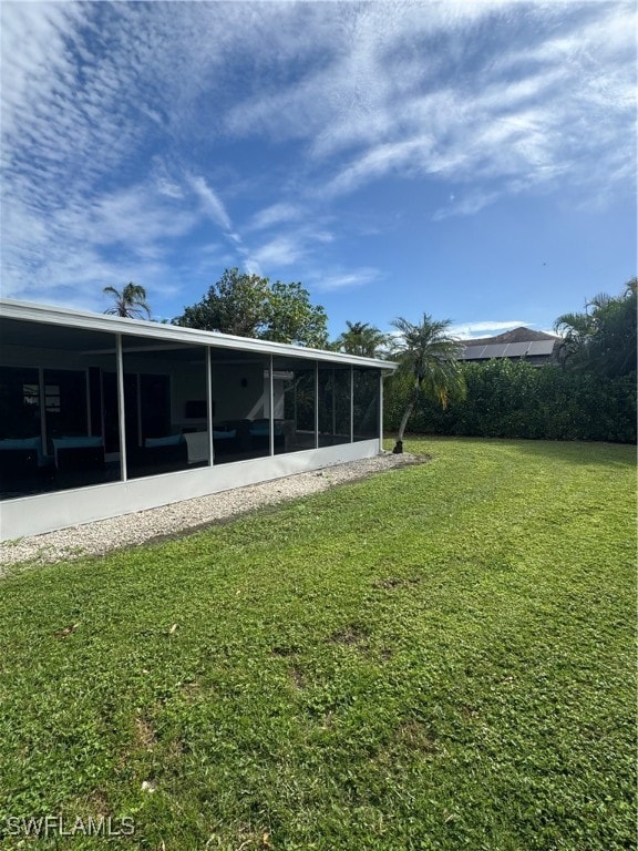 view of yard featuring a sunroom