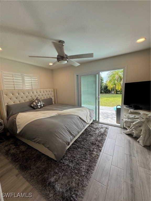 bedroom featuring access to exterior, ceiling fan, and light hardwood / wood-style flooring