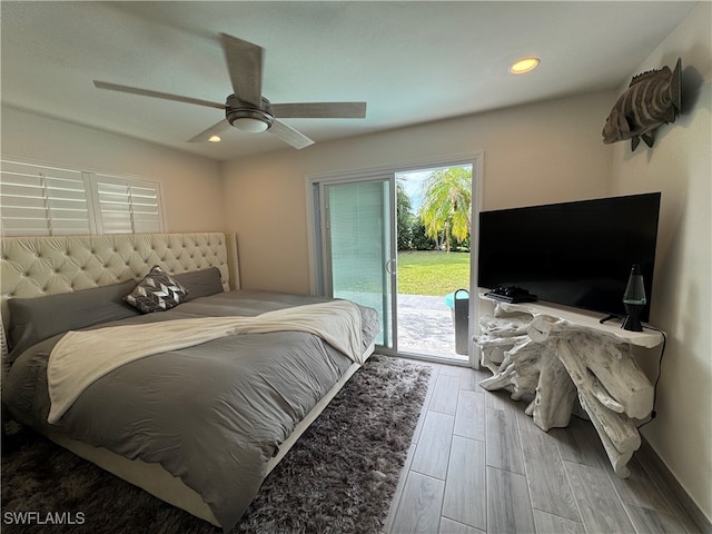 bedroom with ceiling fan, wood-type flooring, and access to outside