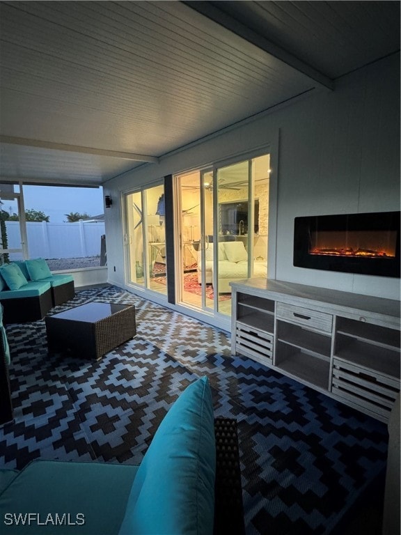 bedroom featuring carpet flooring and beamed ceiling