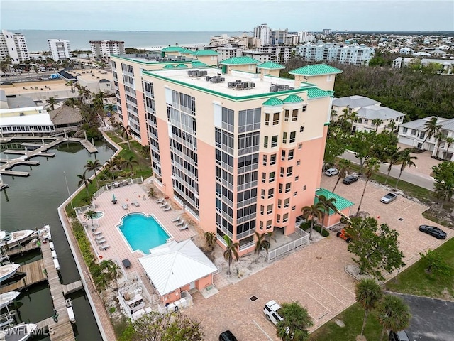 170 Lenell Rd Unit 501, Fort Myers Beach, FL 33931 - view of urban area with a nearby body of water, a pool area, and apartment complex
