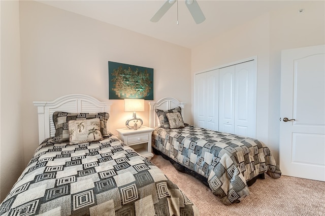 bedroom featuring ceiling fan, a closet, and carpet floors