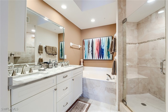 bathroom with tile patterned flooring, vanity, and independent shower and bath