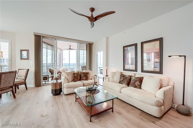 170 Lenell Rd Unit 501, Fort Myers Beach, FL 33931 - living room featuring ceiling fan, light wood-style flooring, and expansive windows