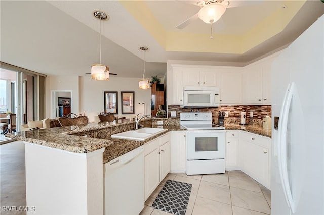 kitchen with kitchen peninsula, white cabinetry, sink, and white appliances