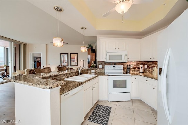170 Lenell Rd Unit 501, Fort Myers Beach, FL 33931 - kitchen with white appliances, a sink, a peninsula, ceiling fan, and backsplash