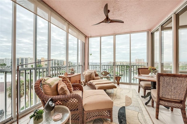 170 Lenell Rd Unit 501, Fort Myers Beach, FL 33931 - sunroom featuring a wall of windows, a city view, and a textured ceiling