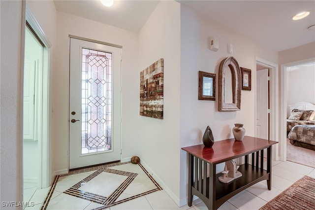 tiled entrance foyer with a wealth of natural light