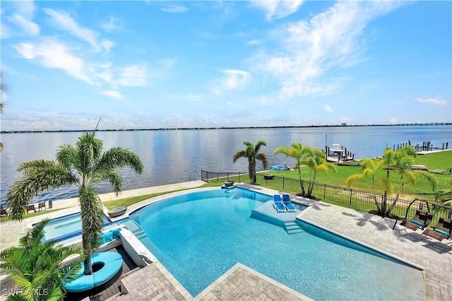 view of swimming pool featuring a patio area and a water view