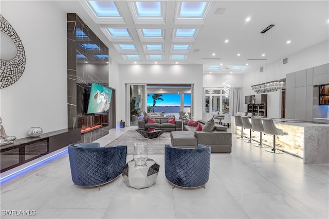 living room with a towering ceiling