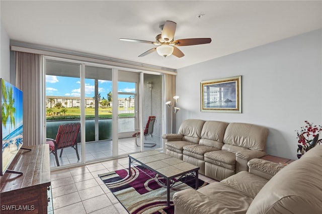 tiled living room with ceiling fan