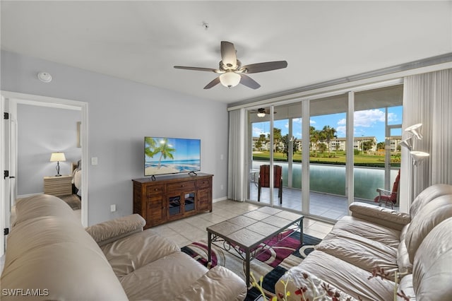 living room featuring ceiling fan and light tile patterned floors