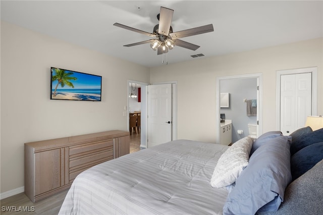 bedroom featuring ensuite bathroom, ceiling fan, and light hardwood / wood-style floors