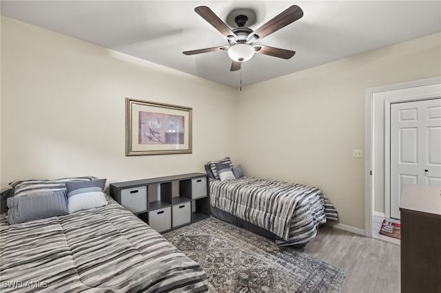 bedroom featuring ceiling fan and light hardwood / wood-style floors