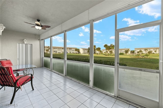 sunroom / solarium with ceiling fan