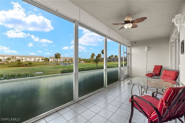 sunroom featuring ceiling fan