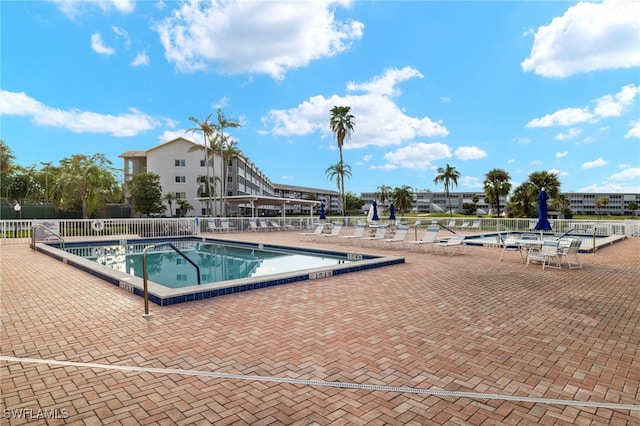 view of swimming pool with a patio