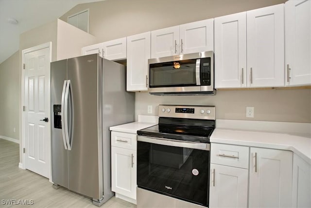 2902 40th St W, Lehigh Acres, FL 33971 - kitchen with appliances with stainless steel finishes, light countertops, and white cabinets