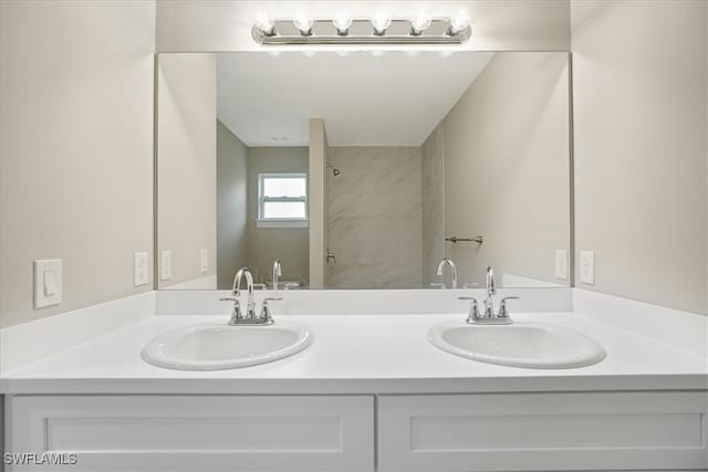 bathroom featuring vanity and a shower