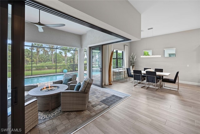 interior space with light wood-type flooring and ceiling fan