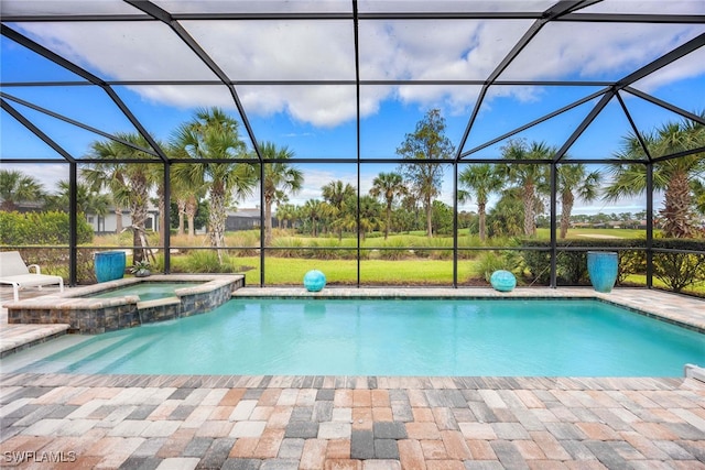 view of swimming pool with glass enclosure and an in ground hot tub