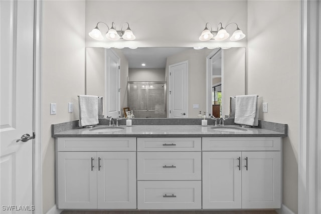 bathroom with vanity and an enclosed shower