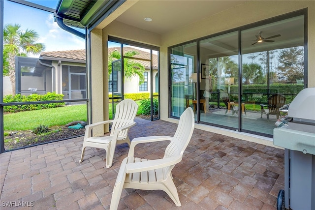 sunroom / solarium with ceiling fan