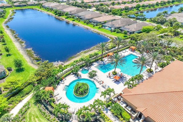 birds eye view of property featuring a water view