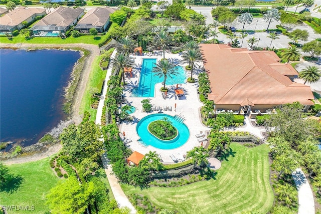 birds eye view of property with a water view