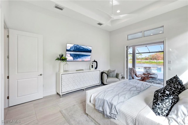 bedroom with access to exterior, ceiling fan, and light tile patterned floors