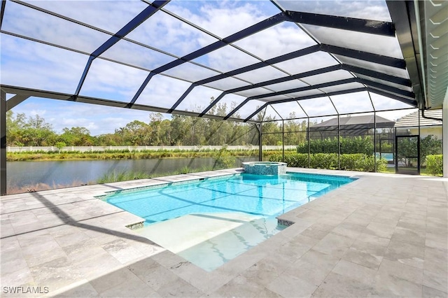 view of pool with a patio, a water view, and glass enclosure